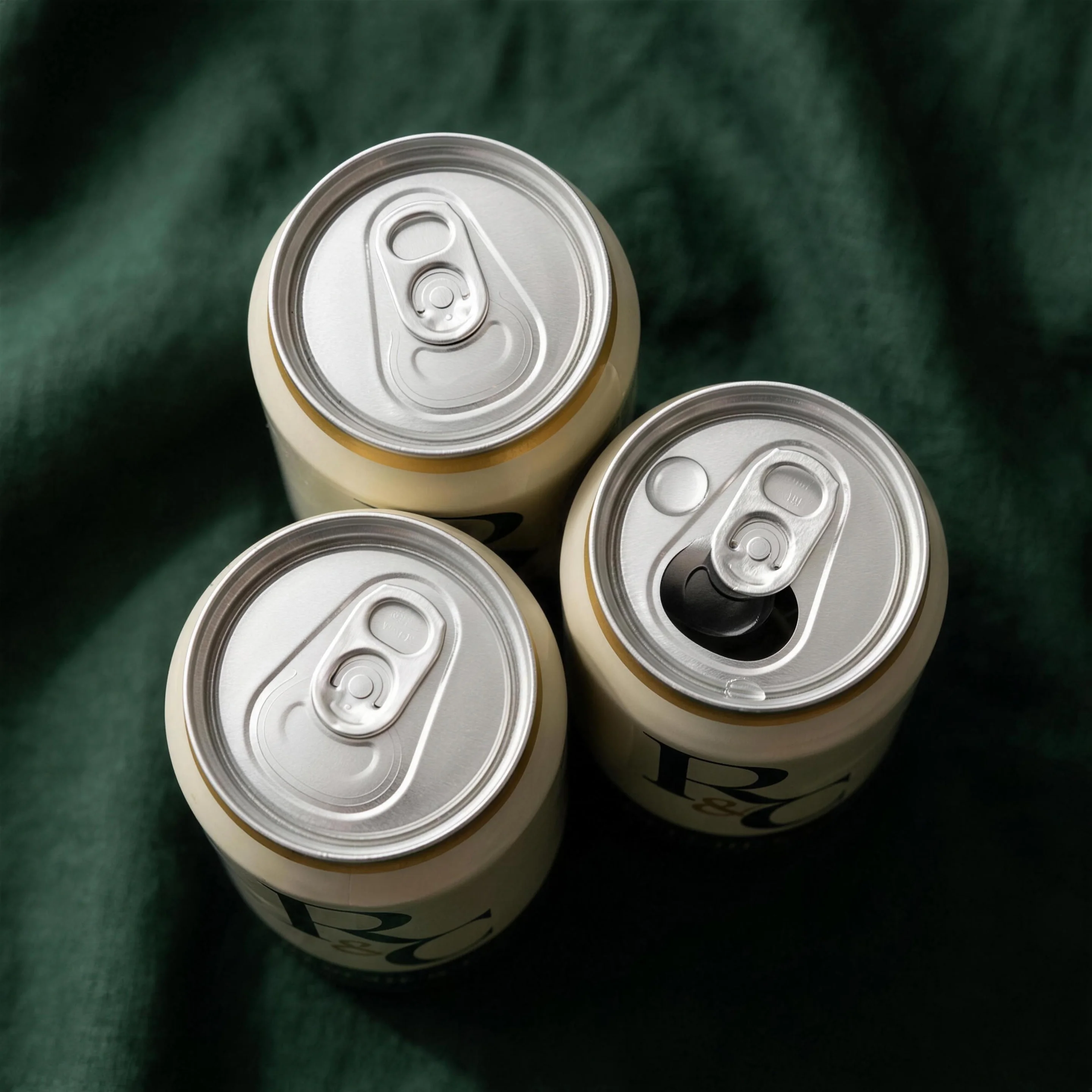 REECHE & CO. cans seen from above on stone